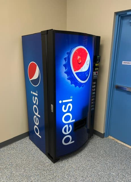 Drink vending machine installed in an office breakroom