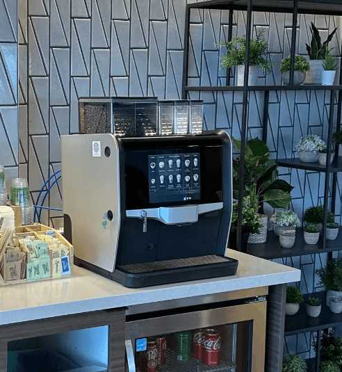 A bean-to-cup coffee machine set up in a breakroom